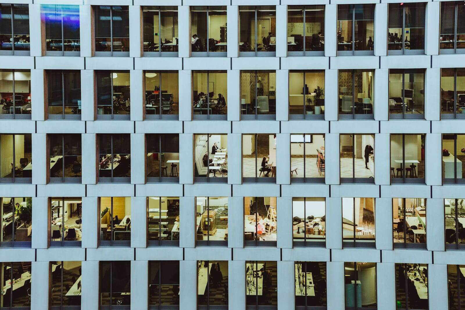 Office building interior with visible desks and employees working.